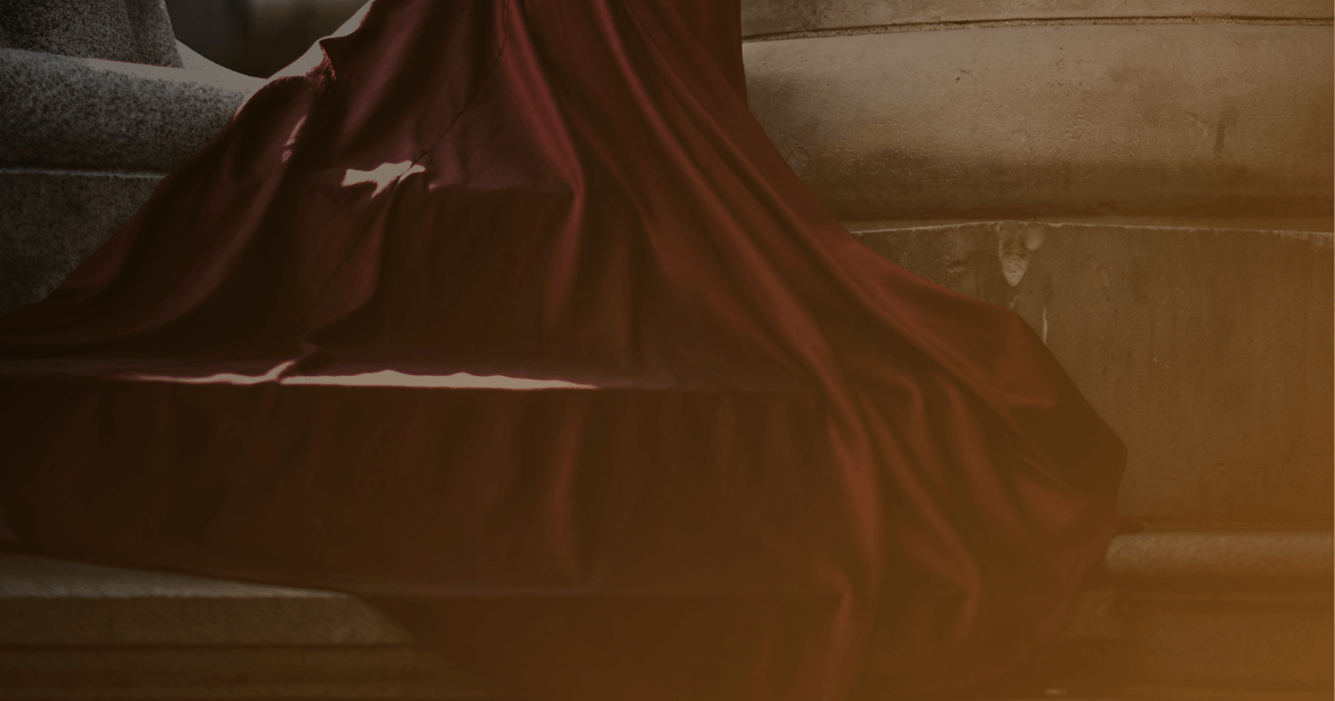 Opulent burgundy gown of the goddess-queen amidst the ancient pillars, bathing in golden light – featured image for the multisensory Ethereal Storytelling Concept: "Dark Serpent Concept: Our Sweet Underworld" authored by Light By Viktoria.