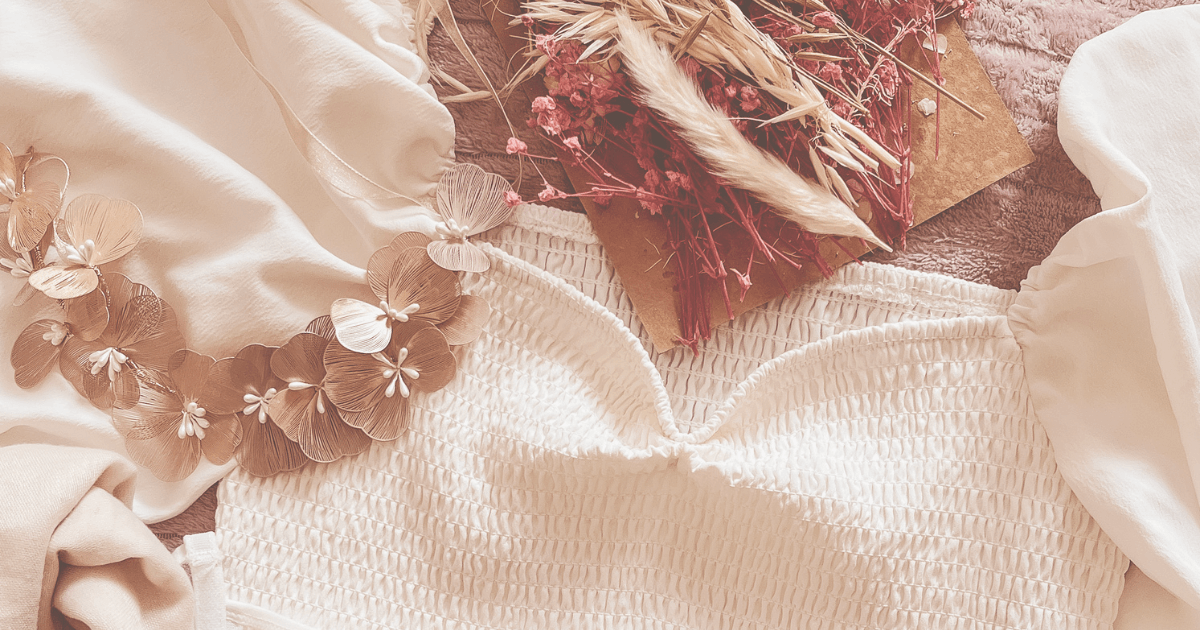 An ensemble of a romantic white dress, a gold floral crown, and dried flowers – featured image for the multisensory Ethereal Storytelling mini atmosphere: "Golden Orchard – An Ethereal Spark".